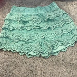 Teal/mint fringy shorts size small.